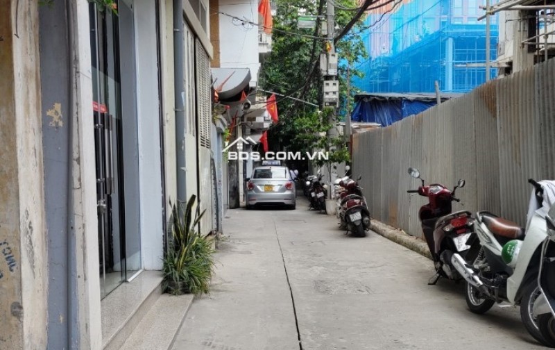 TÔN THẤT TÙNG - TAM KHƯƠNG: Ô TÔ đỗ cửa, ngõ thông, Căn góc, Nở Hậu, 7tầng, thang máy, Ở + KD